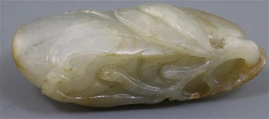 A Chinese pale grey and russet jade carving of peaches, 18th century, 6cm